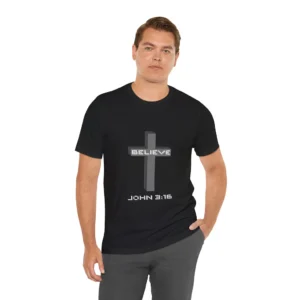 A male model wearing a Black colored "Believe 3:16", with a 3D stacked cross graphic and the words "Believe" and "John 3:16" on the front.