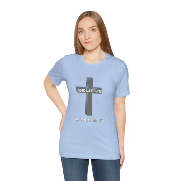 A female model wearing a Soft Blue colored "Believe 3:16", with a 3D stacked cross graphic and the words "Believe" and "John 3:16" on the front.