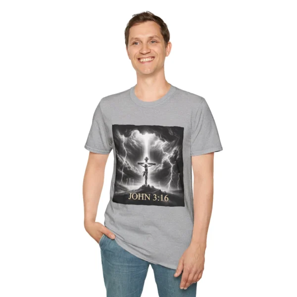 Sport Grey Colored "Cross John 3:16" Faith Collection T-shirt on a male model. Has a picture of Jesus on the Cross with a storm and a lot of lightening. in the background.