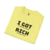 Folded Cornsilk Colored "I Got 99 Problems, But Being Rich Ain't One of Them!" T-shirt.