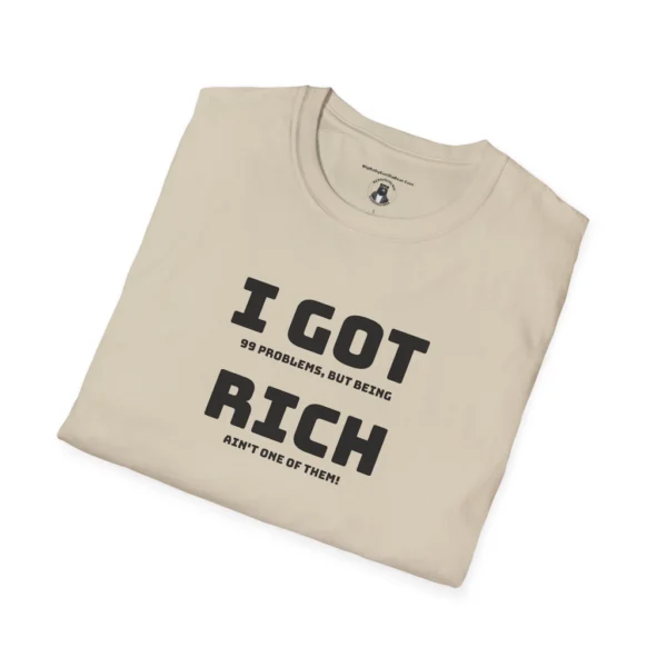 Folded Sand Colored "I Got 99 Problems, But Being Rich Ain't One of Them!" T-shirt.