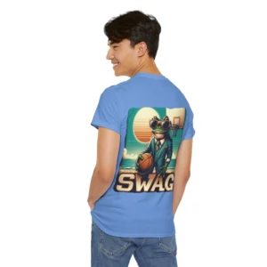 Male model showcasing the "SWAG Frog Backside" men's classic t-shirt, with a frog in a business suit, holding a basketball, on a beach basketball court in the back of one of our Men's Tee Collection shirts! Color Carolina Blue.