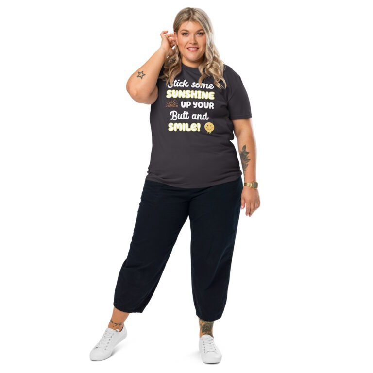 An attractive plus size model with a dark grey t-shirt that says "Stick some sunshine up your butt and smile!"