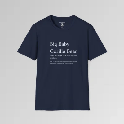 Navy colored t-shirt mockup with the words "Big Baby Gorilla Bear" on the front, in the appearance of a word in a dictionary, including pronunciation beneath the main words and a slash saying "Mythical creature. The text beneath says "The REAL KING of the jungle, pheromones reduced to compensate for inclusion."