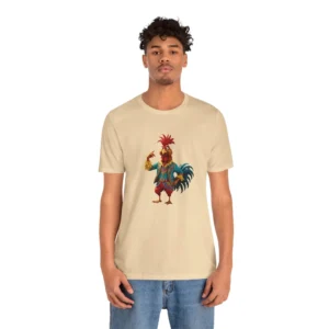 Male Model wearing the BigBabyGorillaBear "Chicken Winner" tee with a festively dressed rooster on the front, wearing an outfit with red, orange, yellows, and blues. Cream Colored shirt.