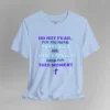 A baby blue colored tee with the words "Do Not Fear, For You Were Fearfully and Wonderfully Made For This Moment" in varying fonts and colors (purple, deep blue, and light aqua blue). There is a graphic, artistic purple cross beneath the words.