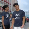 A Man and Woman wearing the Navy Colored tee by BigBabyGorillaBear.Com, which has the words "Im'ma Busta Mess You Up!", with a diagonal pattern where half of the letters are filled with a solid color (white), and the other half are not filled (just an outline of the letters).