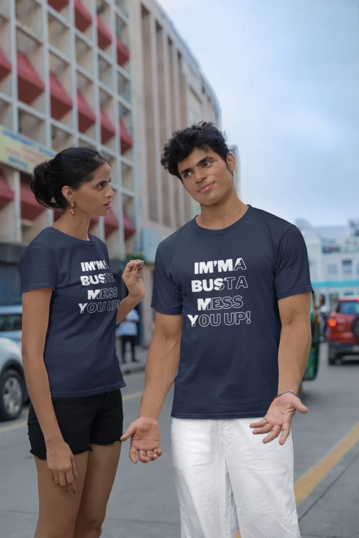 A Man and Woman wearing the Navy Colored tee by BigBabyGorillaBear.Com, which has the words "Im'ma Busta Mess You Up!", with a diagonal pattern where half of the letters are filled with a solid color (white), and the other half are not filled (just an outline of the letters).