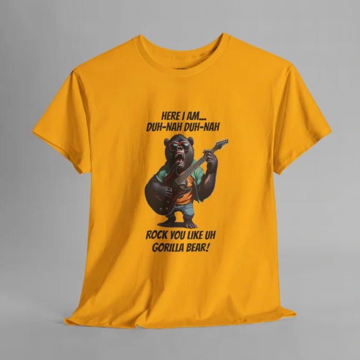 A gold colored t-shirt mockup of a gorilla bear creature, dressed a green button up, an orange undershirt graphic tee, and blue jean shorts and shades, holding an electric guitar. The text on the shirt says "Here I am...Duh-Nah Duh-Nah Rock you like a Gorilla Bear"