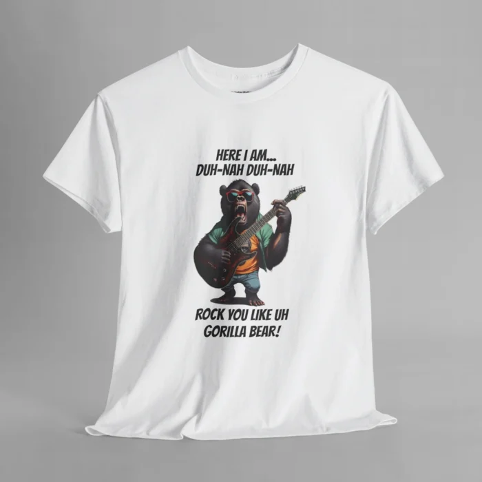 A white colored t-shirt mockup of a gorilla bear creature, dressed a green button up, an orange undershirt graphic tee, and blue jean shorts and shades, holding an electric guitar. The text on the shirt says "Here I am...Duh-Nah Duh-Nah Rock you like a Gorilla Bear"