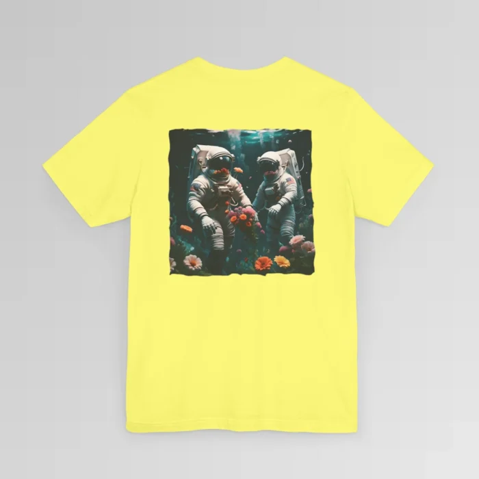 A yellow shirt with a surreal image on the backside of a tee of two astronauts in space suits walking on an ocean floor, with colorful coral, purple, white, peach, and yellow flowers.