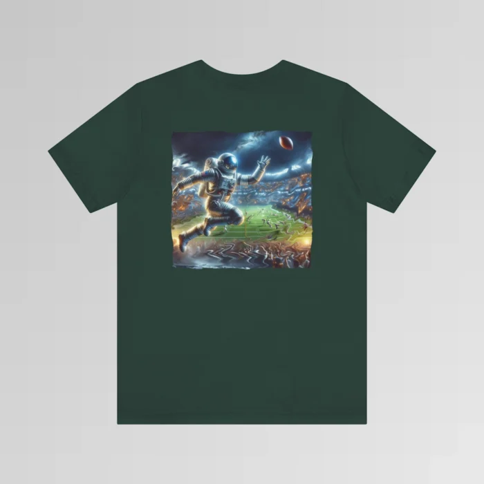 A forest colored graphic tee with an image of an astronaut leaping high above crowds in a football stadium at night, about to catch a football, on the back of the tee. The background is warped, as if the astronaut is moving at super-human speeds.