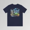 A navy colored graphic tee with an image of an astronaut leaping high above crowds in a football stadium at night, about to catch a football, on the back of the tee. The background is warped, as if the astronaut is moving at super-human speeds.