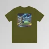 An olive colored graphic tee with an image of an astronaut leaping high above crowds in a football stadium at night, about to catch a football, on the back of the tee. The background is warped, as if the astronaut is moving at super-human speeds.