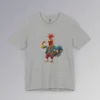 An Athletic Heather t-shirt with anthropomorphic chicken, in red pants, and a blue, red, and gold Spanish style suit, looking cocky, and pointing to itself.