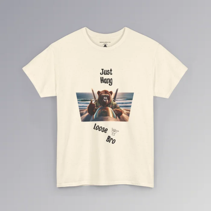 The "Just Hang Loose" BigBabyGorillaBear.Com signature t-shirts. This shirt has one of our iconic gorilla bear creatures riding on top of a fighter jet, throwing a hang loose hand gesture. The background is a beach and ocean the jet is flying over. Above the image it says "Just Hang" and beneath the image, the font is angled down about 30 degrees, and says "Loose Bro" with a clipart of a hand gesture next to loose". Tee color is natural.