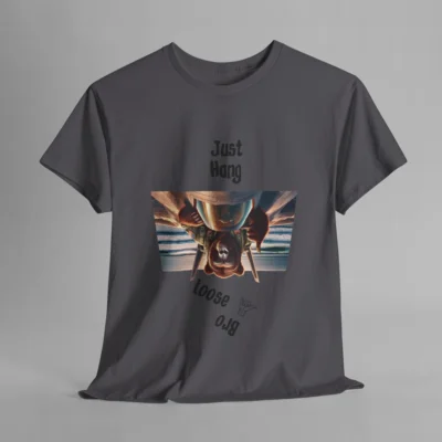 A charcoal colored graphic tee with one of our iconic bear-gorilla hybrid creatures riding on top of a fighter over a beach. The image is turned upside down, and in the shape of an upside down trapezoid. Above the image is writing that says " Just Hang", and beneath the image it says "Loose Bro" at an angle, and with a hang-loose hand gesture clip art.