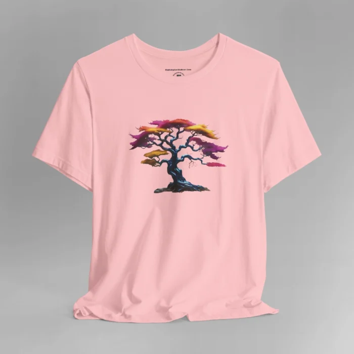 A pink t-shirt with a graphic image of a blued liquid metal tree, with leaves of orange, pink, coral, and magenta on the front of the t-shirt.