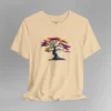 A soft cream t-shirt with a graphic image of a blued liquid metal tree, with leaves of orange, pink, coral, and magenta on the front of the t-shirt.