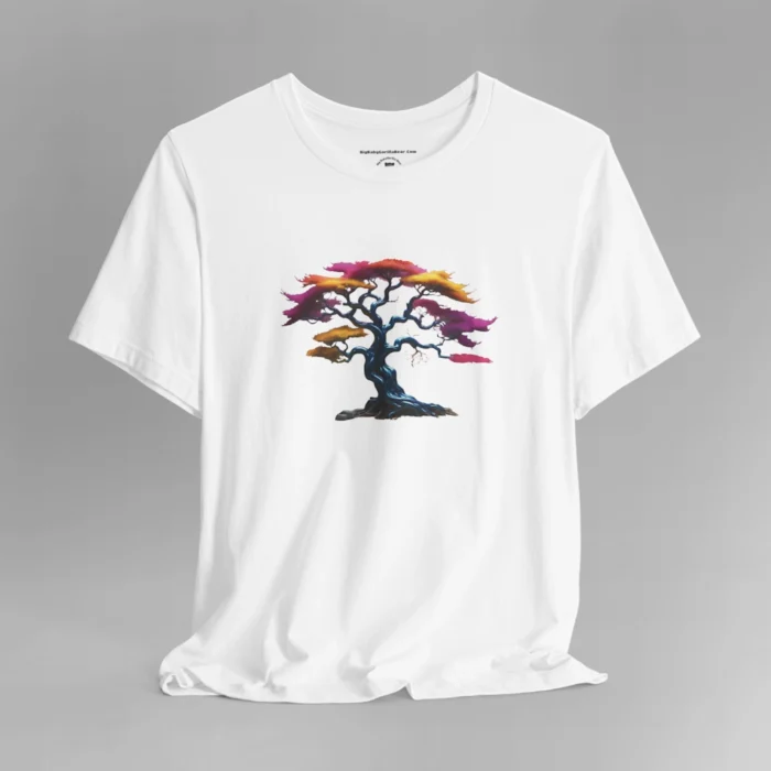 A white t-shirt with a graphic image of a blued liquid metal tree, with leaves of orange, pink, coral, and magenta on the front of the t-shirt.