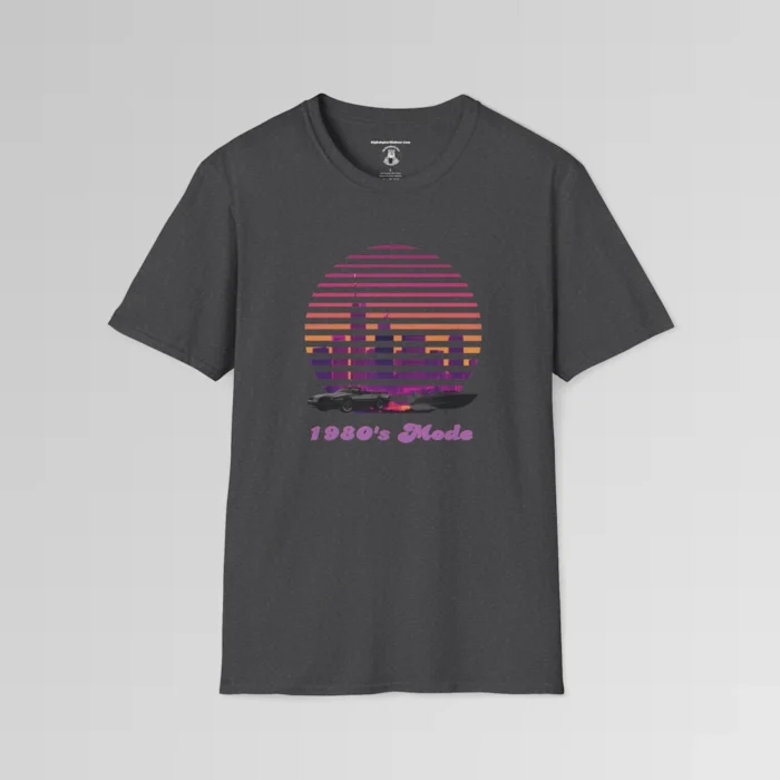 A dark heather shirt with a view of the Miami, FL skyline (not necessarily an accurate view), with a blind effect, as if it appears as if the viewer is looking through window blinds. At the bottom is a generic 1980's style convertible, and a speed boat. Beneath the image says "1980's Mode" . The image has pinks, oranges, greys, purples, and some yellows.