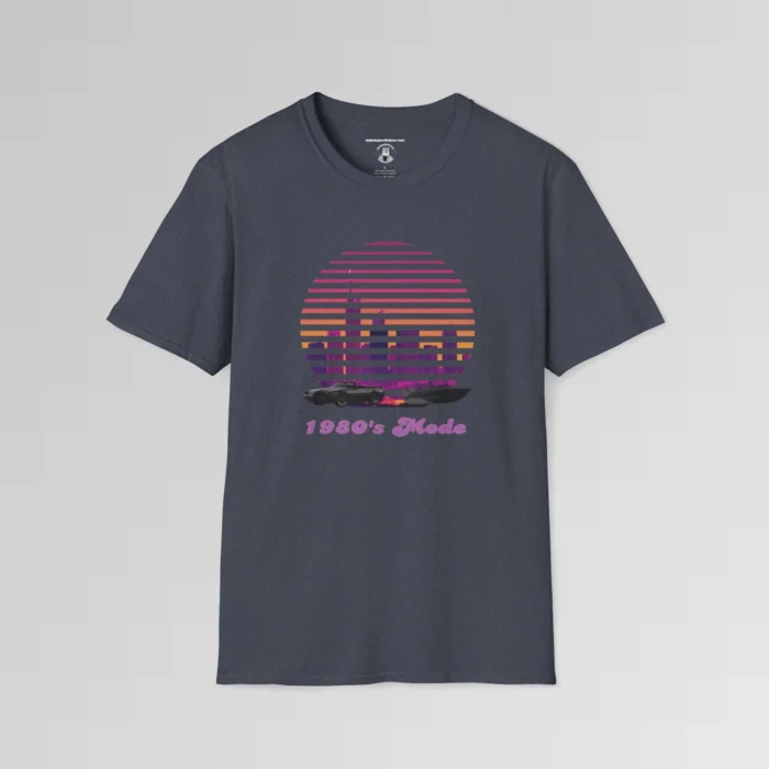 A heather navy shirt with a view of the Miami, FL skyline (not necessarily an accurate view), with a blind effect, as if it appears as if the viewer is looking through window blinds. At the bottom is a generic 1980's style convertible, and a speed boat. Beneath the image says "1980's Mode" . The image has pinks, oranges, greys, purples, and some yellows.