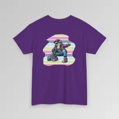 A purple colored t-shirt mockup with a 1980's styled anthropomorphic frog, wearing pants, shoes, hat, and jacket with shades. The frog is kneeling by a beatbox, and there is a non-symmetrical backdrop with varied colored lines in a ship-lap pattern. Shirt graphic colors are pinks, greens, blues, purples, steel blues, light blues, and white and cream colors.