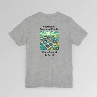 An athletic heather colored shirt with the words "Wastewater Treatment Plant" above and image of a waste water treatment plant sketch (with green, silver, blue, and white colors). Beneath the image are the words "Where Your #2 Is Our #1". Graphic is on the backside of shirt.