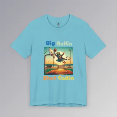 A turquoise colored shirt with a frog in a suit dunking a basketball, on a beach court with a big sun in the background, and the words "Big Ballin" above the graphic, and "Shot Callin" below the graphic. (Front of shirt).