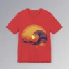 The frontside of a heather red colored t-shirt with an oriental feel, and a blue wave white-capping, with a sunset in the background. The wave looks as if it touches the sun. There are mountains, clouds, and gentle waves, with hues of orange, red, and yellows.