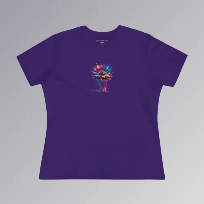 A purple colored t-shirt with a vibrant, multi-colored flower on the front of the t-shirt. The graphic looks as if it has been created with splashing vibrant colored paints, with hues of blue, violet, pink, and orange.