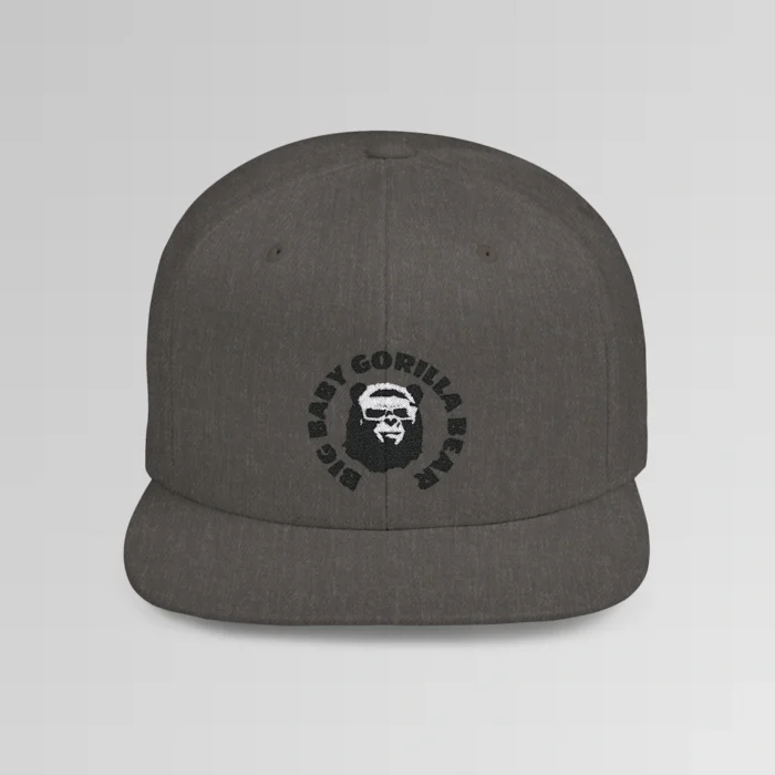 A mockup of the front of the "BBGB Flat Bill Snapback Cap", with "Big Baby Gorilla Bear" embroidered in a circular font pattern surrounding the Big Baby Gorilla Bear Mascot embroidered on a dark heather cap.