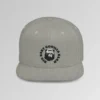 A mockup of the front of the "BBGB Flat Bill Snapback Cap", with "Big Baby Gorilla Bear" embroidered in a circular font pattern surrounding the Big Baby Gorilla Bear Mascot embroidered on a heather grey cap.