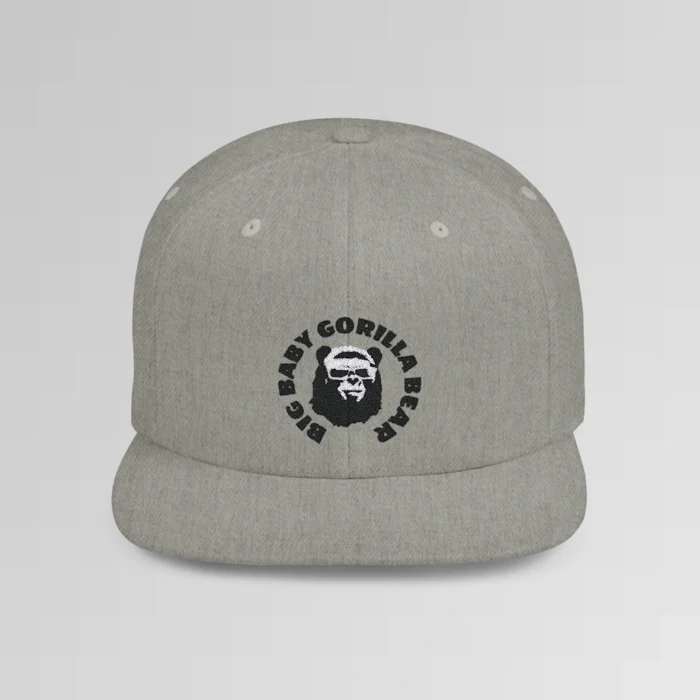 A mockup of the front of the "BBGB Flat Bill Snapback Cap", with "Big Baby Gorilla Bear" embroidered in a circular font pattern surrounding the Big Baby Gorilla Bear Mascot embroidered on a heather grey cap.