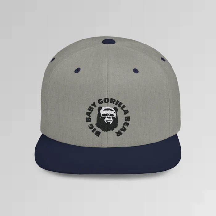 A mockup of the front of the "BBGB Flat Bill Snapback Cap", with "Big Baby Gorilla Bear" embroidered in a circular font pattern surrounding the Big Baby Gorilla Bear Mascot embroidered on a dark heather cap.