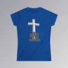 The front of a t-shirt with 3D text which states "Christ Is My Firm Foundation", from a slightly left perspective, in the shape of a simple house, with an old, wooden cross in the background. Color: Royal. Her Style.