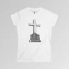 The front of a t-shirt with 3D text which states "The Rock On Which I Stand", from a slightly left perspective, in the shape of a simple house, with an old, wooden cross in the background. Color: White. Her Style.