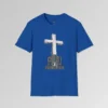 The front of a t-shirt with 3D text which states "Christ Is My Firm Foundation", from a slightly left perspective, in the shape of a simple house, with an old, wooden cross in the background. Color: Royal. His Style.