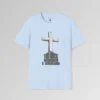 The front of a t-shirt with 3D text which states "The Rock On Which I Stand", from a slightly left perspective, in the shape of a simple house, with an old, wooden cross in the background. Color: Light Blue. His Style.