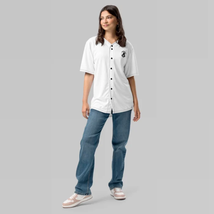 A female model, showcasing the frontside of the BBGB Recycled Baseball Jersey from BigBabyGorillaBear.Com (White jersey). Has the Big Baby Gorilla Bear circular logo on the front left breast of the jersey, stacked, and in curved font, with a super-imposed - white jersey.