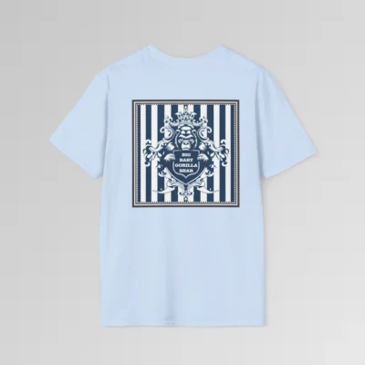 The back of a light blue colored t-shirt mockup with navy and white vertical stripes in a grey, triple lined frame, with an elaborate crest of a gorilla bear creature, holding a shield that has the words "Big Baby Gorilla Bear" on it.