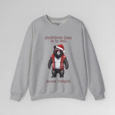 A sport grey sweatshirt with a slightly pixelated Big Baby Gorilla Bear Mascot image in a Christmas sweater, with a Santa hat on, with words in 3-D font that say "Christmas Rock Is In Dah House Tonight!
