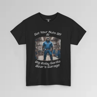The front of a T-shirt mockup that reads "Get Your Nuts Off At Big Baby Gorilla Bear's Garage", with an image of the Big Baby Gorilla Bear Mascot in a blue mechanic jump suit, standing in a garage. Black shirt.