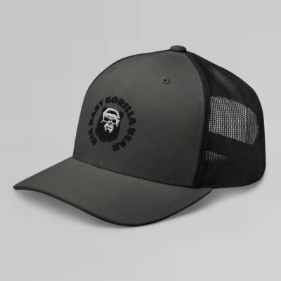 Left side view of a Charcoal Black mesh trucker cap, with the Big Baby Gorilla Bear mascot's face and the Big Baby Gorilla Bear Name encircling the face, Embroidered in black and white on the front of the cap.