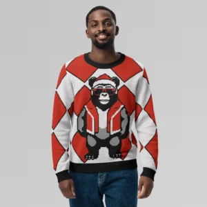 A male model showcasing the front side of a sweater with a red checkered knit sweatshirt with a slightly pixelated gorilla-bear hybrid (our mascot) on the front and back. The gorilla bear is wearing a Christmas Hat, Red shades, and a Santa hat.