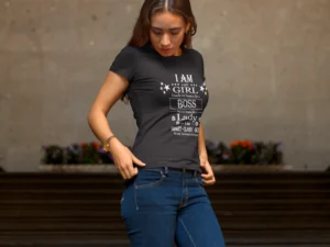 Female model wearing a black Big Baby Gorilla Bear "Girl's Girl" tee, looking down while