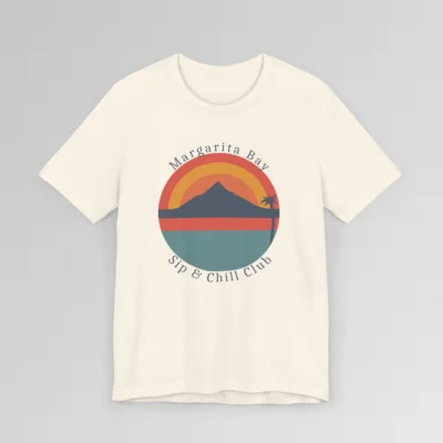 A natural colored t-shirt mockup (front) with a circular, minimalistic design of water, sky, mountains, and a palm tree. The colors are orange, yellow, deep blue, and blue. The tee has the words "Margarita Bay" and "Sip & Chill Club" wrapped around the circular design.