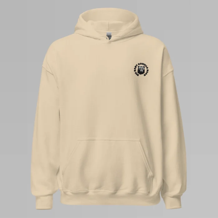 A sand colored hoodie with with the Big Baby Gorilla Bear mascot's face and the Big Baby Gorilla Bear name Embroidered in black and white in a circular pattern on the front left breast of the hoodie.