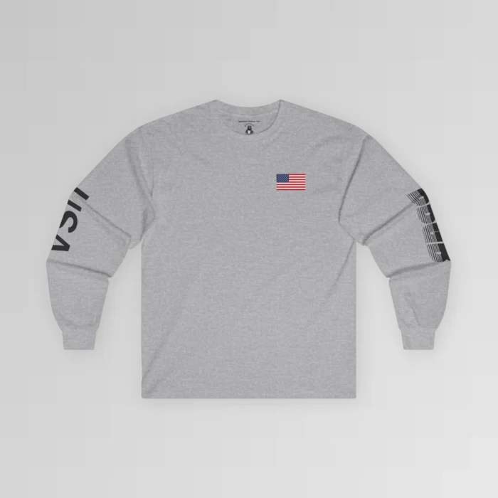 The frontside of the sport grey colored BBGB USA Full Stack Long Sleeve Tee, with an American Flag on the front left breast section, and the letters "USA" on the right sleeve, and "BBGB" on the left sleeve. The Letters "BBGB" have transparent lines going through the lower portion of the letters.