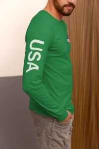 Right side view of male model wearing an Irish green "BBGB USA Long Sleeve" Tee.